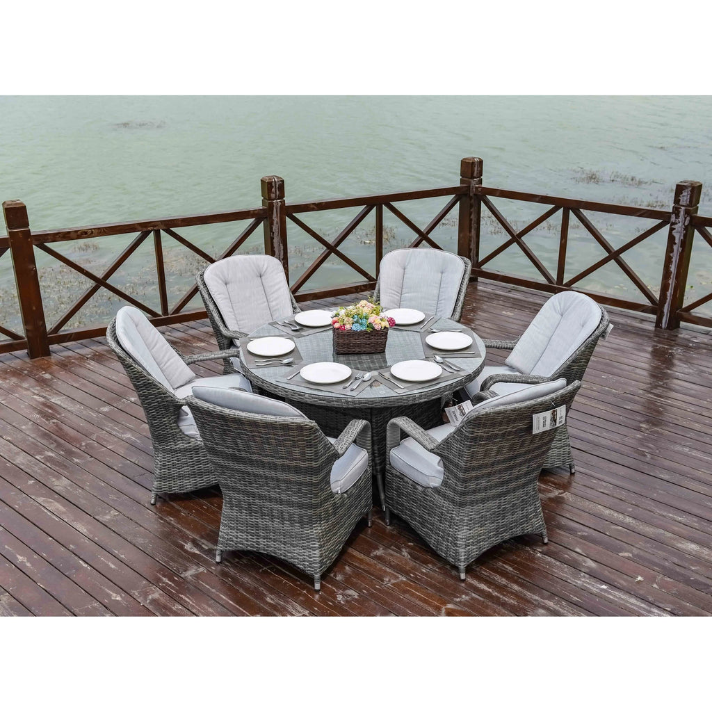 Set da pranzo rotondo da esterno in 7 pezzi in vimini di rattan con cuscini di Moda Furnishings