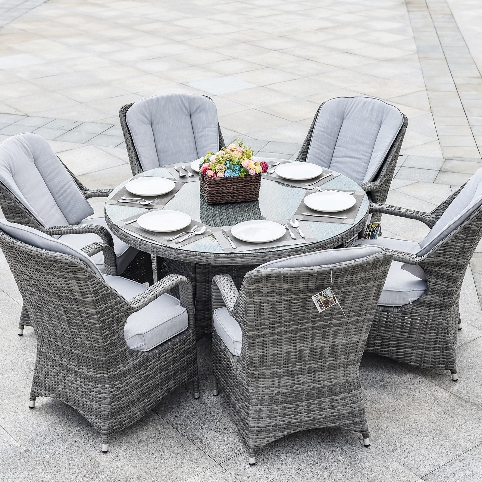 Set da pranzo rotondo da esterno in 7 pezzi in vimini di rattan con cuscini di Moda Furnishings